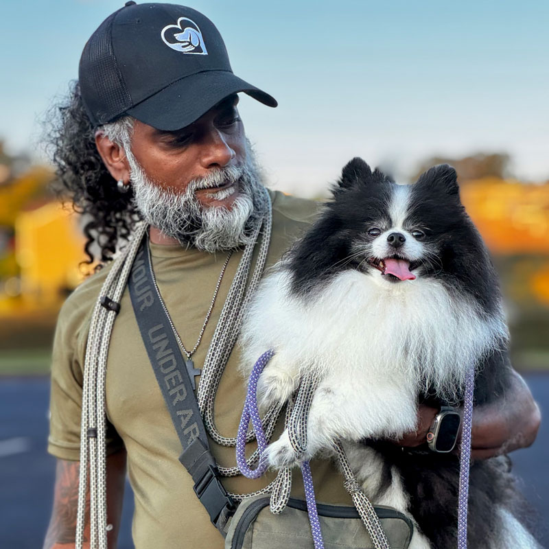 man holding a dog